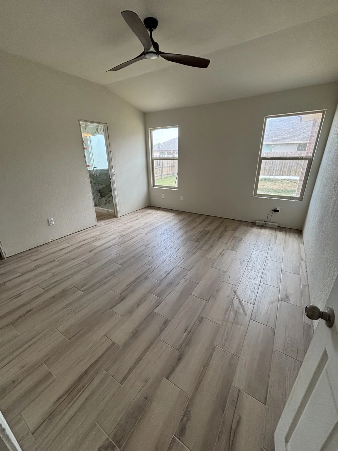 Completed wood-look flooring in a bright residential room