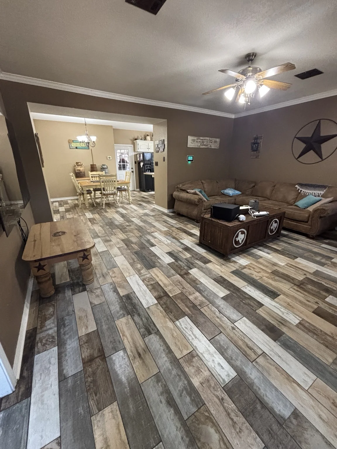 Wide view of installed multicolored wood-look floor